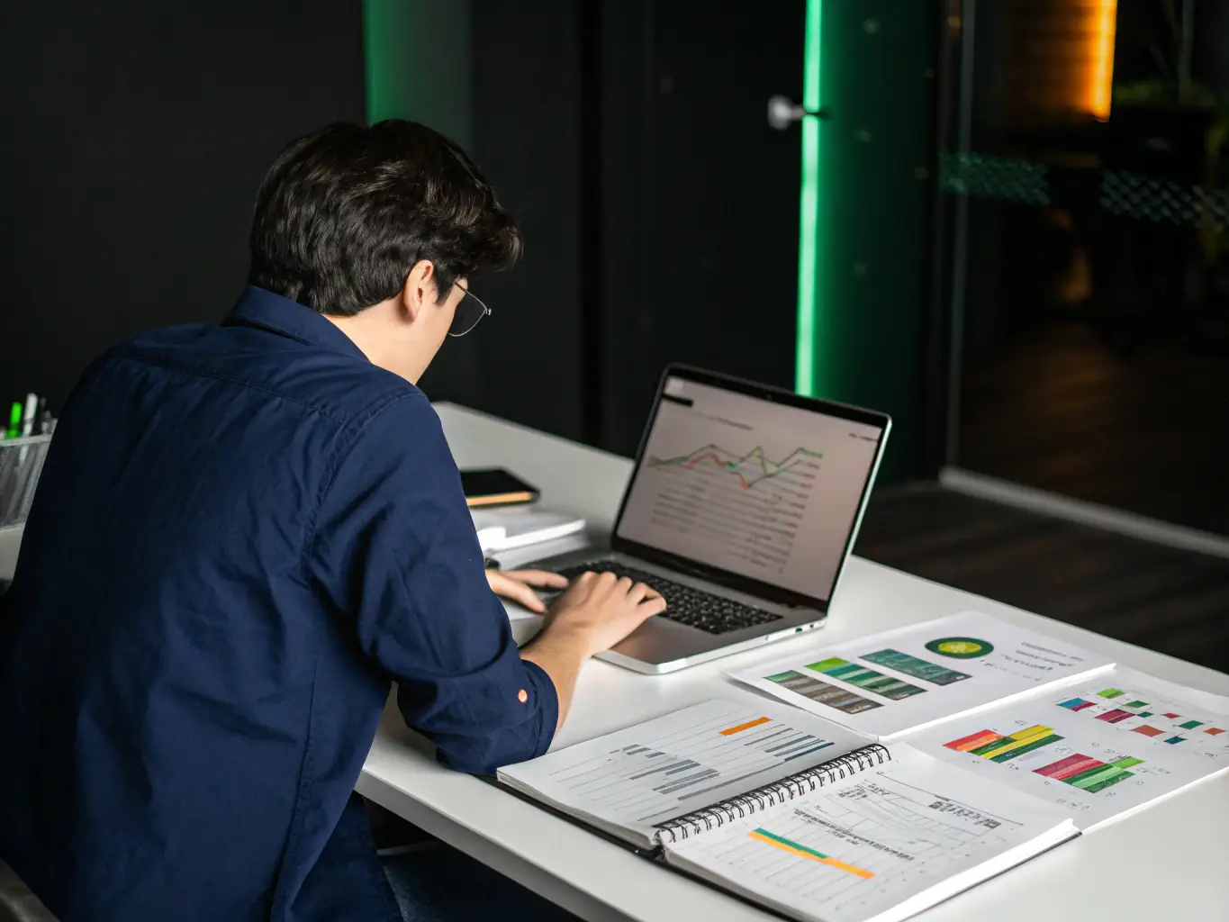 A data scientist analyzing complex datasets on a large monitor, highlighting the importance of data analysis in AI and machine learning.